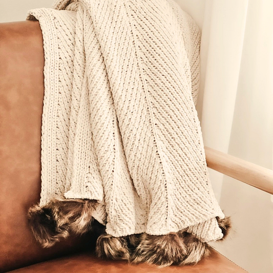 Luxury chenille knit throw blanket with faux fur poms draped over a sofa – ultra soft and cozy, Pottery Barn inspired